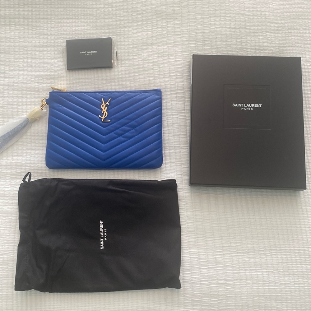 Saint Laurent Electric Blue Wristlet Clutch with gold details.